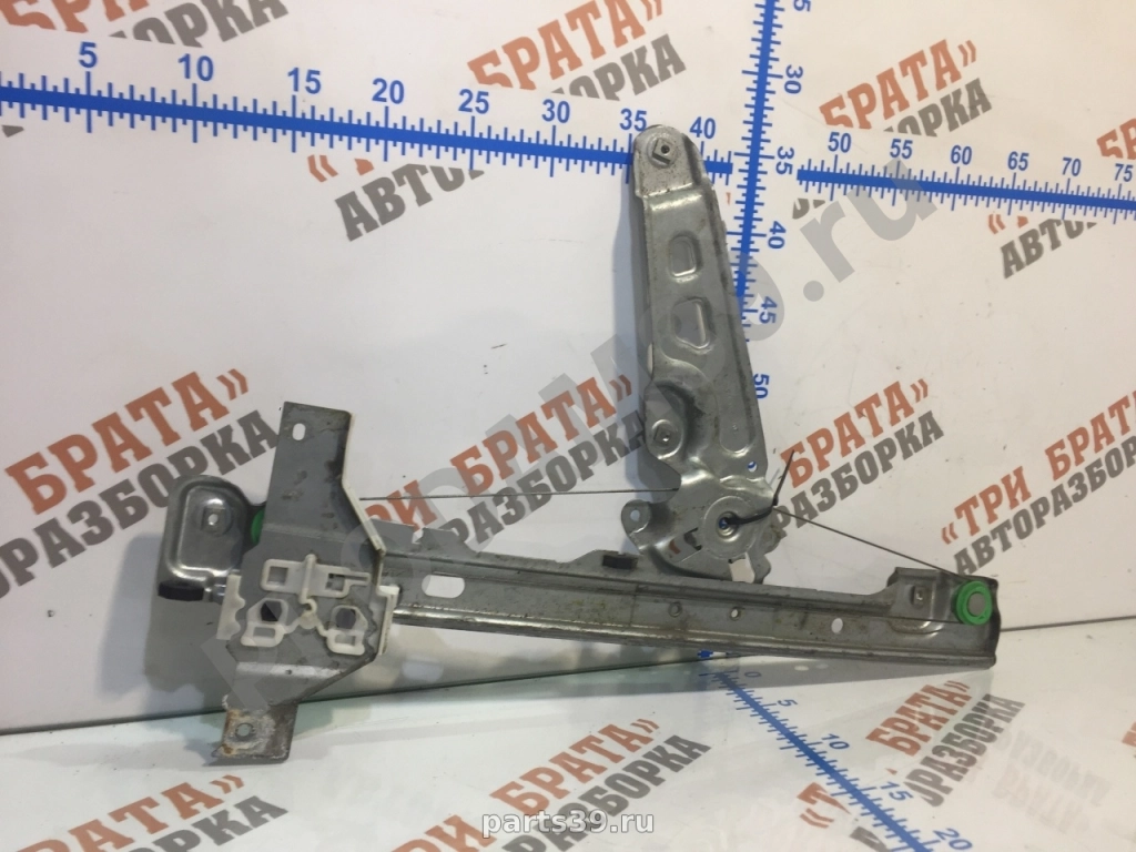 Стеклоподъемник передний левый ( электрический)