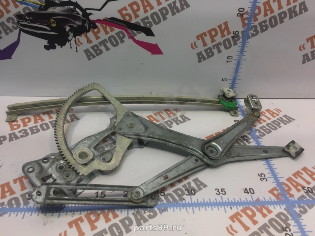 Стеклоподъемник передний левый ( электрический)