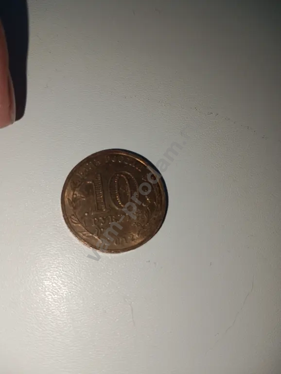 монета золотая