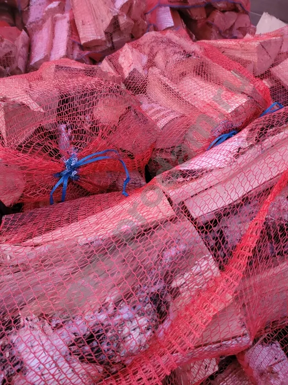 Дрова в сетках вязанки березовые колотые