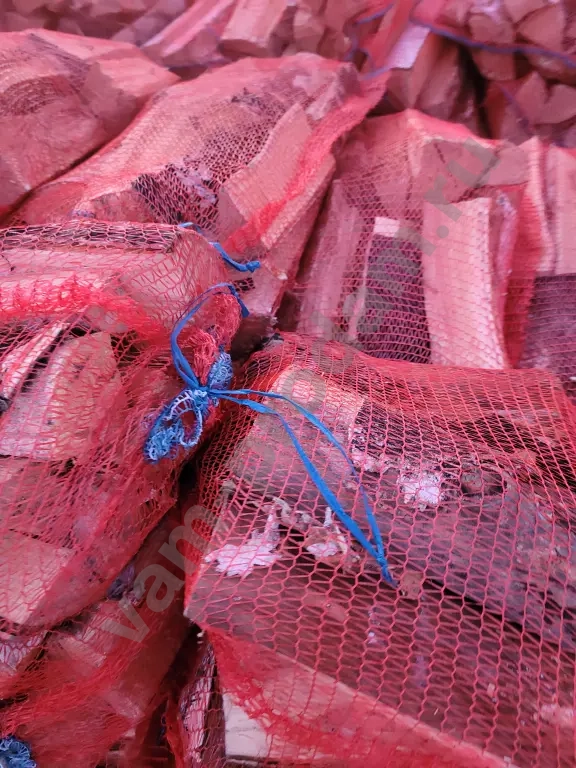 Дрова в сетках вязанки березовые колотые